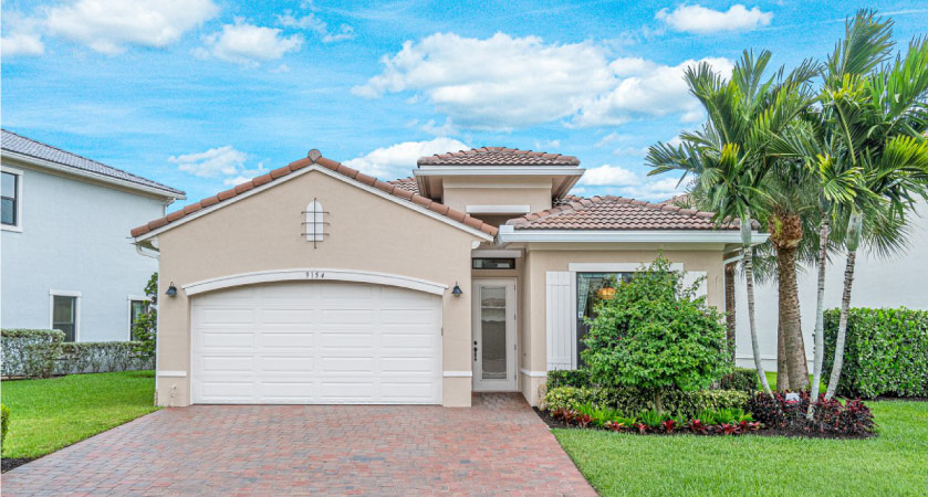 A one-story stucco home in Coral Springs, Florida.