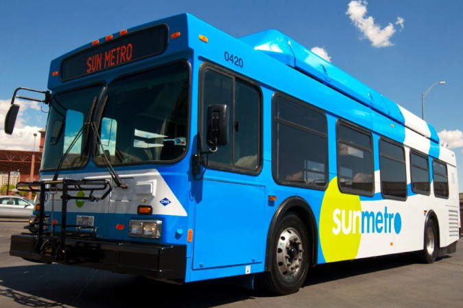  A Sun Metro city bus in El Paso, Texas, waiting to pick up passengers on a sunny day.