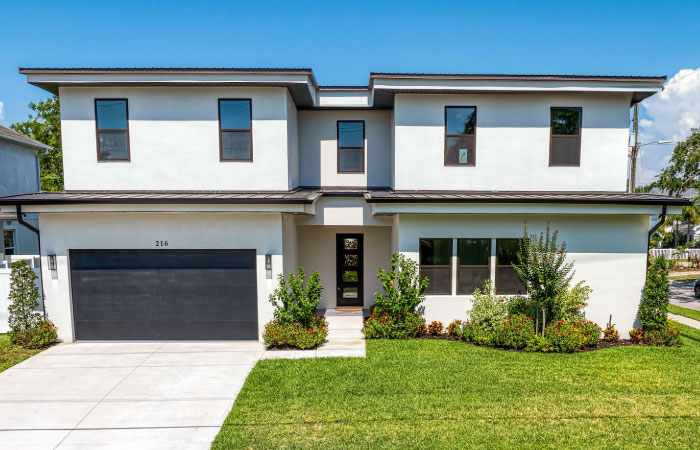  A large, single-family home with a flat roof in the Swann Estates neighborhood of Tampa, Florida