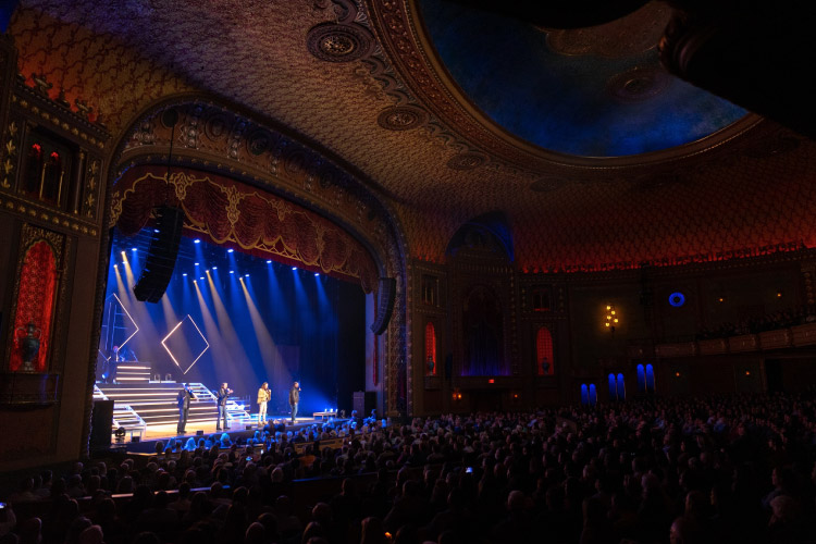 A packed audience enjoys a live performance at the opulent Tennessee Theatre in Knoxville, Tennessee.