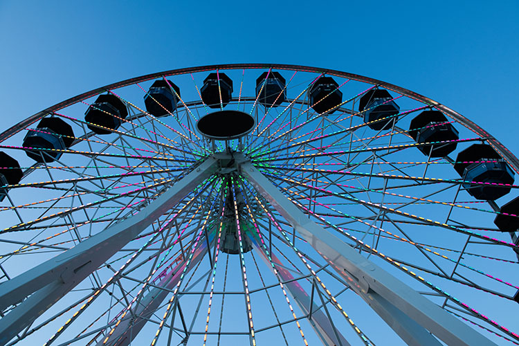 A low-angle shot of a Ferris wheel in Oklahoma City.