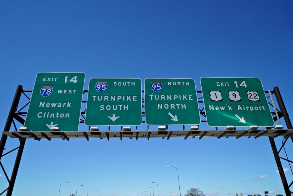 Signs on a highway overpass in the Tri-state area of New York