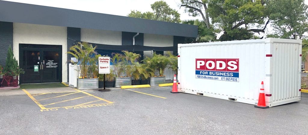 PODS shipping container in a restaurant parking lot
