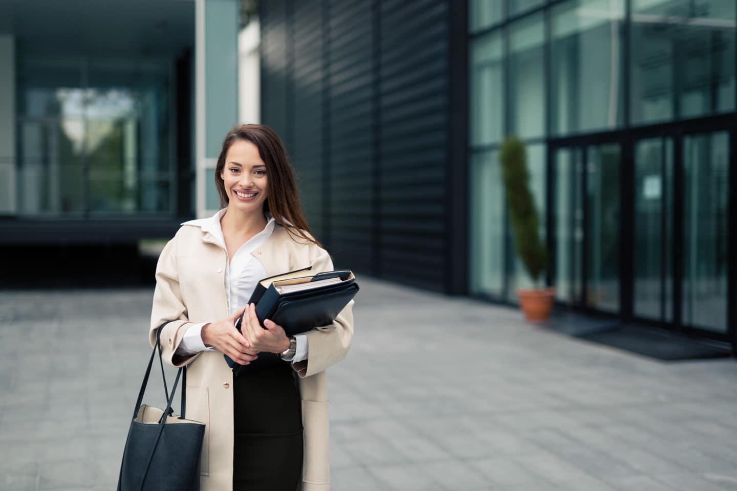 Woman outside new office after an employee relocation move