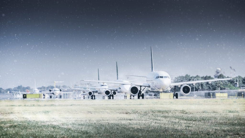 Airplanes in a filed outside an airport